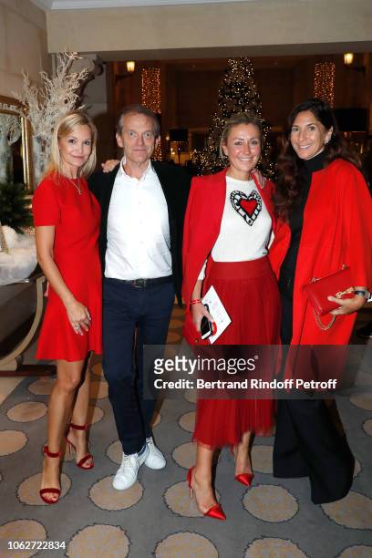 Marie Saldmann, her husband Doctor Frederic Saldmann, Claire Duroc-Danner and Karine Journo attend the "Sauvez le Coeur des Femmes - Red Defile" Show...