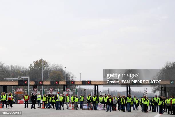 Demonstrator wearing Yellow Vests protest against the rising of the fuel and oil prices on November 17, 2018 on the A 41 near Grenoble central...