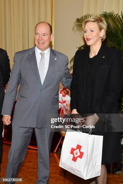 Prince Albert II of Monaco and Princess Charlene of Monaco attend the Christmas Gifts Distribution on November 17, 2018 in Monte-Carlo, Monaco.