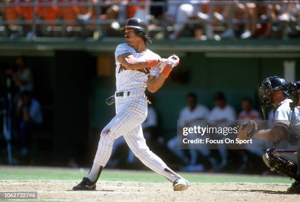 Benito Santiago of the San Padres bats against the San Francisco Giants during an Major League Baseball game circa 1990 at Jack Murphy Stadium in San...