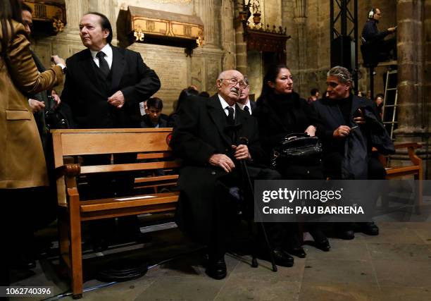 Montserrat Marti , daughter of Spanish opera singer Montserrat Caballe, sits on a bench with her father Bernabe Martinez , as the singer's brother...