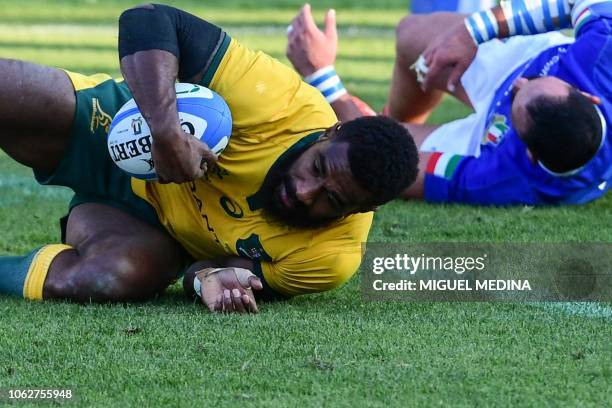 Australia's wing Marika Koroibete scores a try during the international rugby union test match Italy vs Australia on November 17, 2018 at the Euganeo...