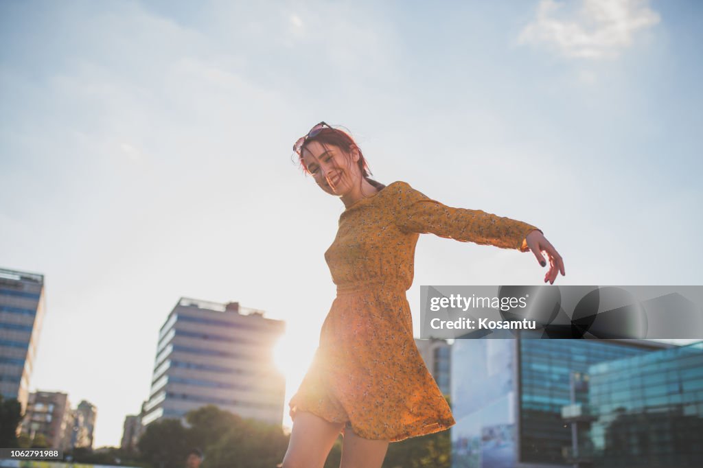 Happy Girl Dancing In City