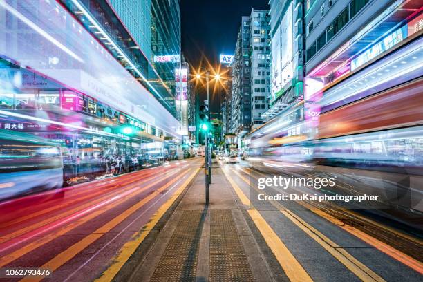 tsim sha tsui nathan road, hong kong - long exposure street stock pictures, royalty-free photos & images