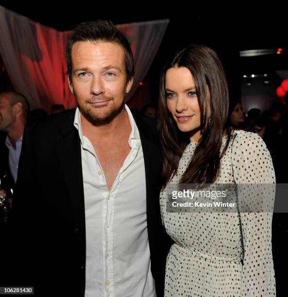 Actors Sean Patrick Flanery and Gina Holden pose at the after party for the premiere of Lionsgate's "Saw 3D" at Level 3 on October 27, 2010 in Los...