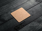 Cork pad, beer coaster Mockup on the wooden table