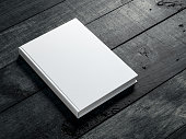 White book Mockup on dark wooden table background