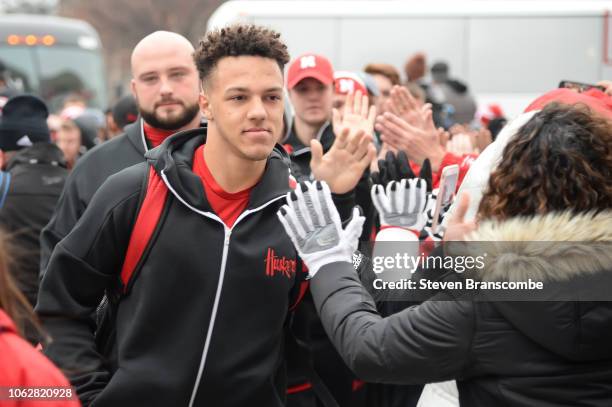 Quarterback Adrian Martinez of the Nebraska Cornhuskers greets fans as the team arrives before the game against the Michigan State Spartans at...