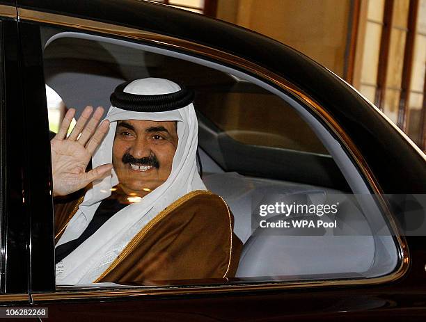 The Emir of Qatar, Sheikh Hamad bin Khalifa Al-Thani waves goodbye to Queen Elizabeth II and Prince Philip, the Duke of Edinburgh at Windsor Castle...