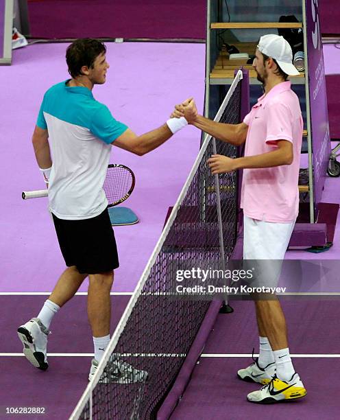 Illya Marchenko of Ukraine is congratulated by Konstantin Kravchuk of Russia during day five of the International Tennis Tournamen St. Petersburg...