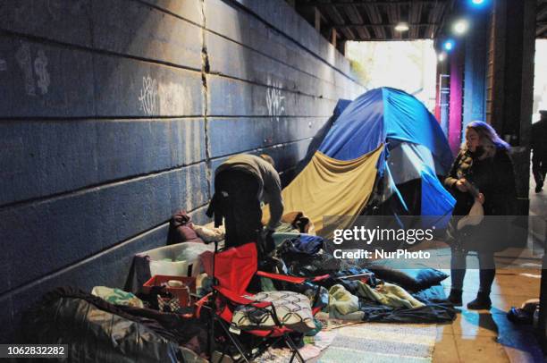 Homeless Encampment Eviction In Philadelphia, USA on November 15, 2018. A homeless tent community under the railroad trestles are roused early on...