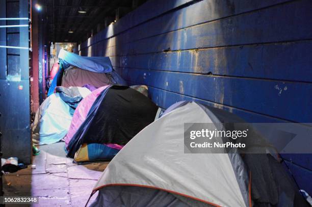 Homeless Encampment Eviction In Philadelphia, USA on November 15, 2018. A homeless tent community under the railroad trestles are roused early on...