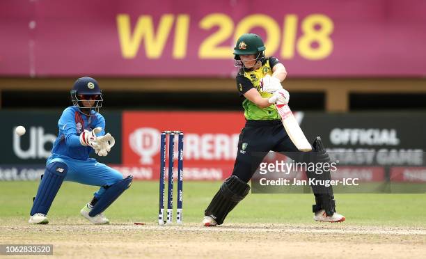 Meg Lanning of Australia bats with Taniya Bhatia, wicket keeper of India looking on during the ICC Women's World T20 2018 match between India and...