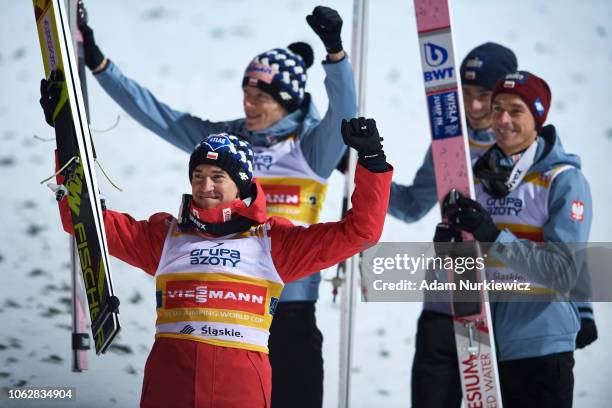 Jakub Wolny and Dawid Kubacki and Piotr Zyla and Kamil Stoch all from Poland celebrate their victory while FIS Ski Jumping World Cup 2018-2019 -...