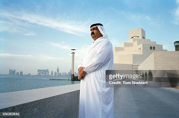 Portrait of His Highness the Emir Sheikh Hamad bin Khalifa Al-Thani outside the new Museum of Islamic Art in Doha, Qatar. The country's huge oil and...