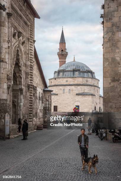 On 10 November 2018, tourists walk between the historic Cifte Minare Medrese and the Sifaiye Medresesi in central Sivas, a city in Turkey's Anatolia...