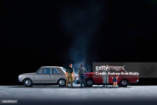 model people gathered around a model car crash - toy car accident stock pictures, royalty-free photos & images