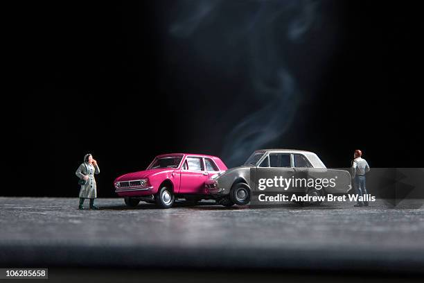 model people standing near toy car crash scene - toy car accident stock pictures, royalty-free photos & images