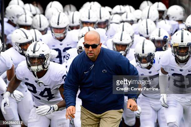 Head coach James Franklin of the Penn State Nittany Lions runs onto the field with his team before taking on the Rutgers Scarlet Knights at...
