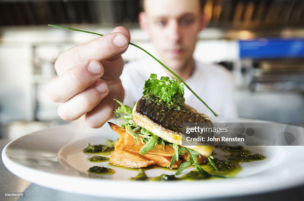 Chefs doing kitchen preparation and service 