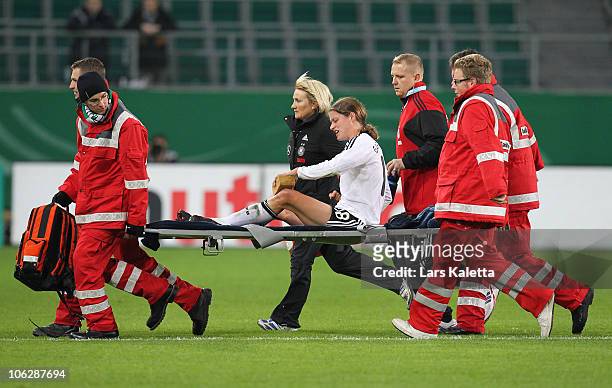 Kerstin Garefrekes of Germany leaves the pitch due to an injury during the women's international friendly match between Germany and Australia at...
