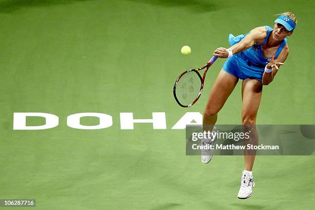 Elena Dementieva of Russia serves to Samantha Stosur of Australia during day three of the WTA Championships at the Khalifa Tennis Complex on October...