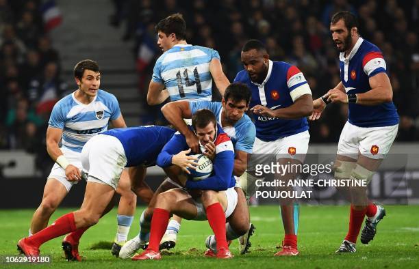 Argentina's centre Matias Orlando tackles France's fly-half Camille Lopez during the international rugby union test match between France and...