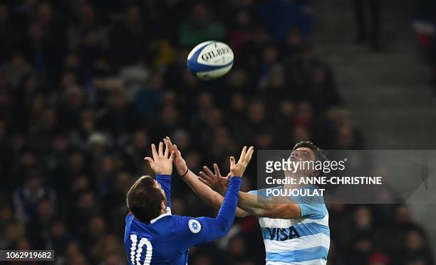 Argentina's winger Bautista Delguy jumps for the ball with France's fly-half Camille Lopez during the international rugby union test match between...