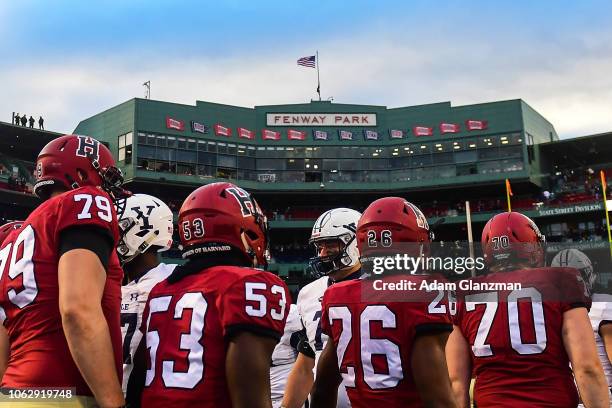 The Harvard Crimson and the Yale Bulldogs shake hands after a game at Fenway Park on November 17, 2018 in Boston, Massachusetts.