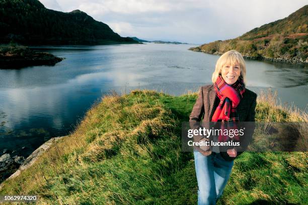 woman in tartan, loch carron, scotland - loch carron stock pictures, royalty-free photos & images