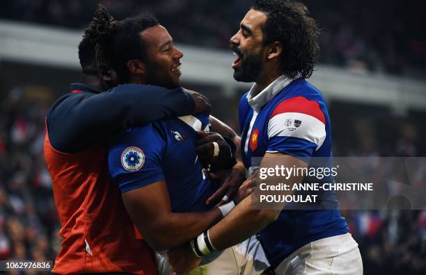 France's winger Teddy Thomas celebrates with France's winger Yoann Huget after scoring his second try during the international rugby union test match...