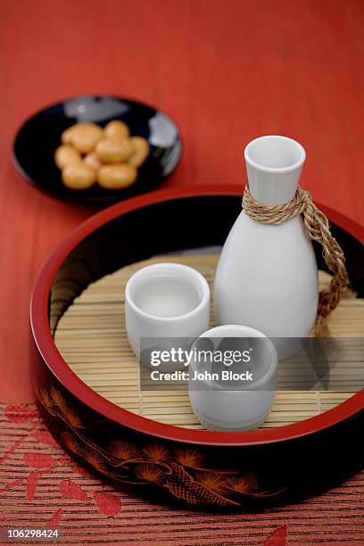 sake and japanese rice crackers - sake stock pictures, royalty-free photos & images