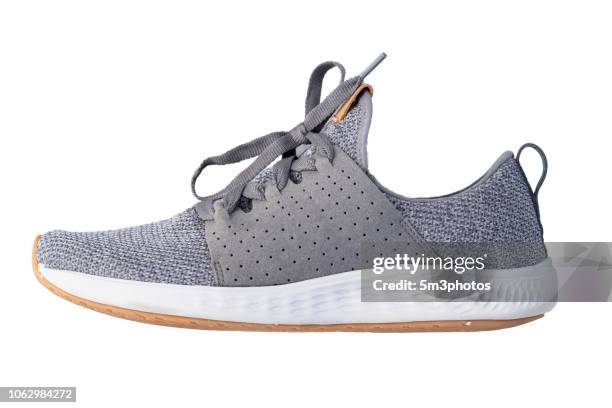 gray tennis shoe running exercise sneaker copy space - gray shoe stock-fotos und bilder