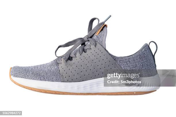 gray tennis shoe running exercise sneaker copy space - sports shoe stock-fotos und bilder