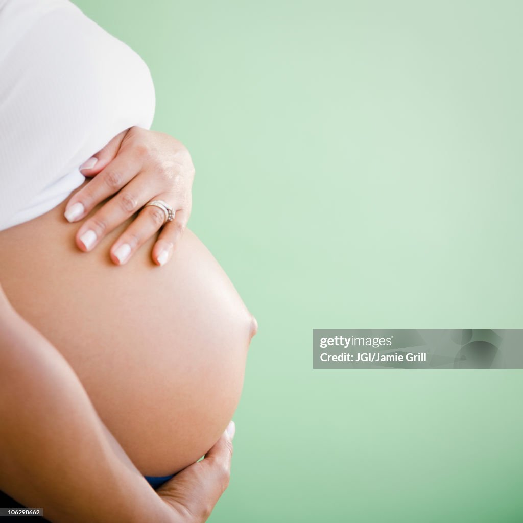 Close up of pregnant Black woman's stomach