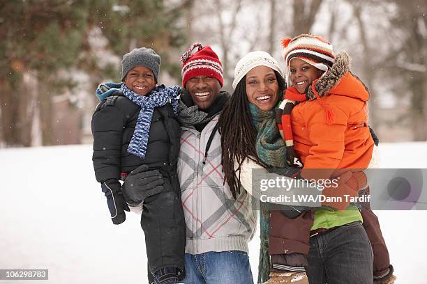 african american family enjoying the snow - season 4 fotografías e imágenes de stock