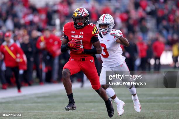 Darryl Jones of the Maryland Terrapins runs past Damon Arnette of the Ohio State Buckeyes during the second half at Capital One Field on November 17,...