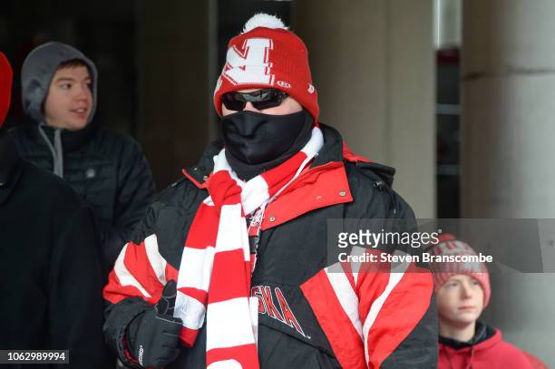 Fan for the Nebraska Cornhuskers prepares for the weather before the game against the Michigan State Spartans at Memorial Stadium on November 17,...
