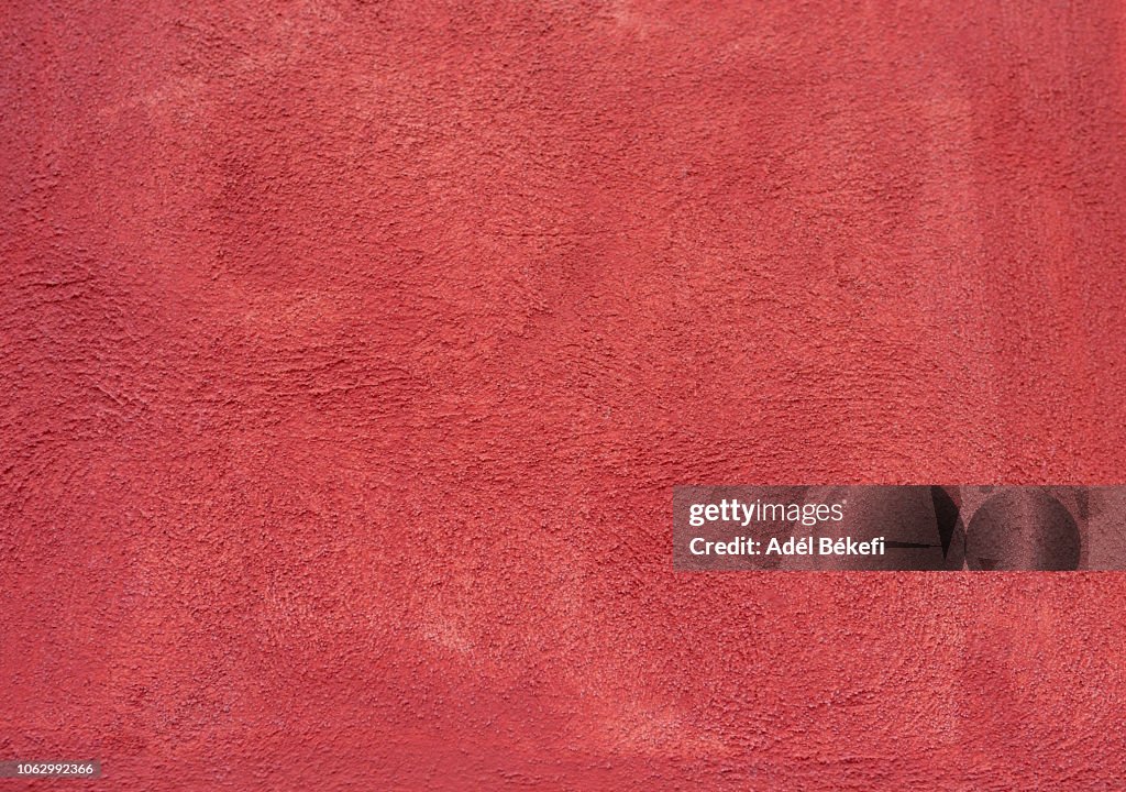 Red  Plastered rusty concrete wall