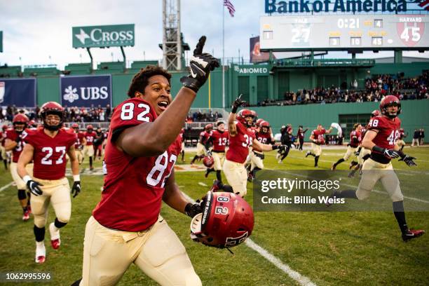 Members of the Harvard Crimson react after defeating the Yale Bulldogs during a game on November 17, 2018 at Fenway Park in Boston, Massachusetts.