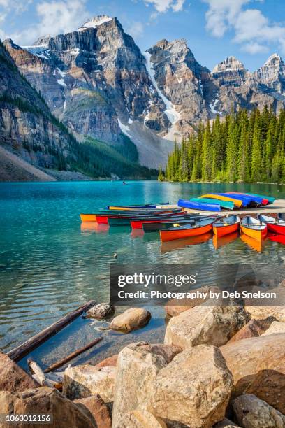 moraine lake with colorful canoes banff national park canada - canadian rockies 個照片及圖片檔