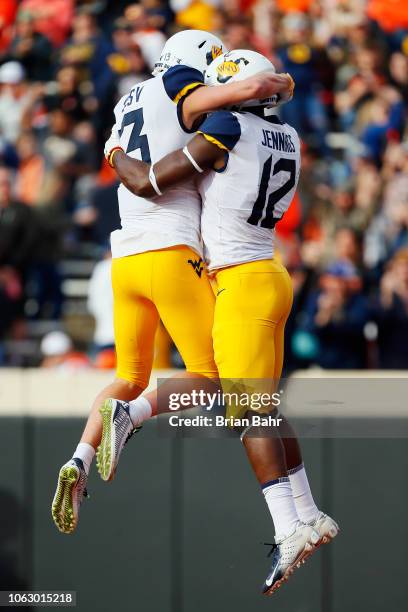 Wide receiver Gary Jennings Jr. #12 of the West Virginia Mountaineers celebrates his touchdown with wide receiver David Sills V against the Oklahoma...