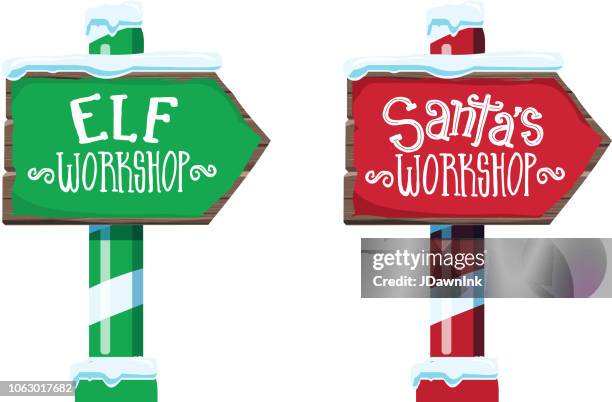 wooden winter christmas santa workshop and elf workshop sign with handwriting or hand lettered text - santa stock illustrations