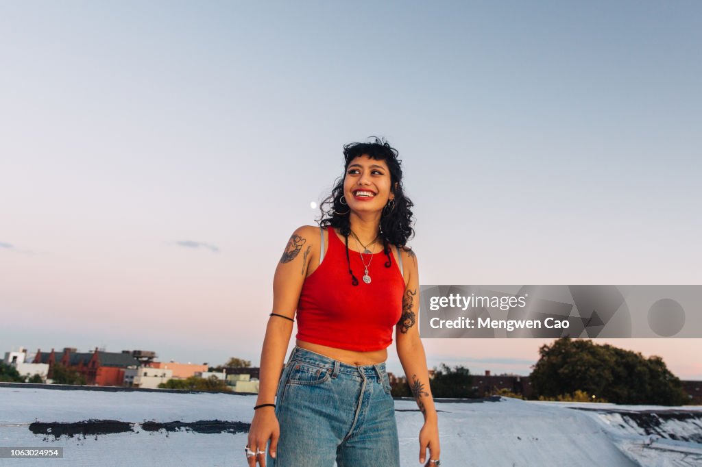 Portrait of young woman on rooftop