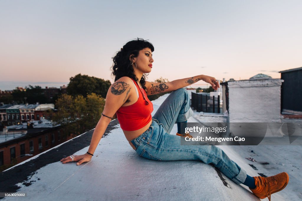 Portrait of young woman on rooftop