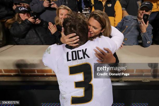 Drew Lock of the Missouri Tigers hugs his mother in the stands during the second half of the game between the Missouri Tigers and the Tennessee...