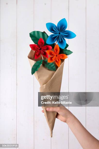 colorful origami flower bouquet - bouquet orange stock-fotos und bilder