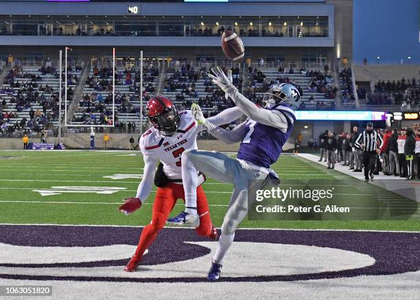 Wide receiver Isaiah Zuber of the Kansas State Wildcats has the pass in the end zone broken up by defensive back Douglas Coleman III of the Texas...