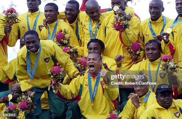 The Cameroon team celebrate after winning Gold in the Men's Gold Medal Soccer Match between Cameroon v Spain at the Sydney 2000 Olympic Games, Sydney...