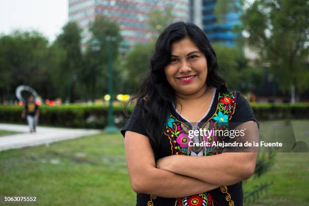 cheerful young indigenous woman the city. - monterrey mexico stock pictures, royalty-free photos & images
